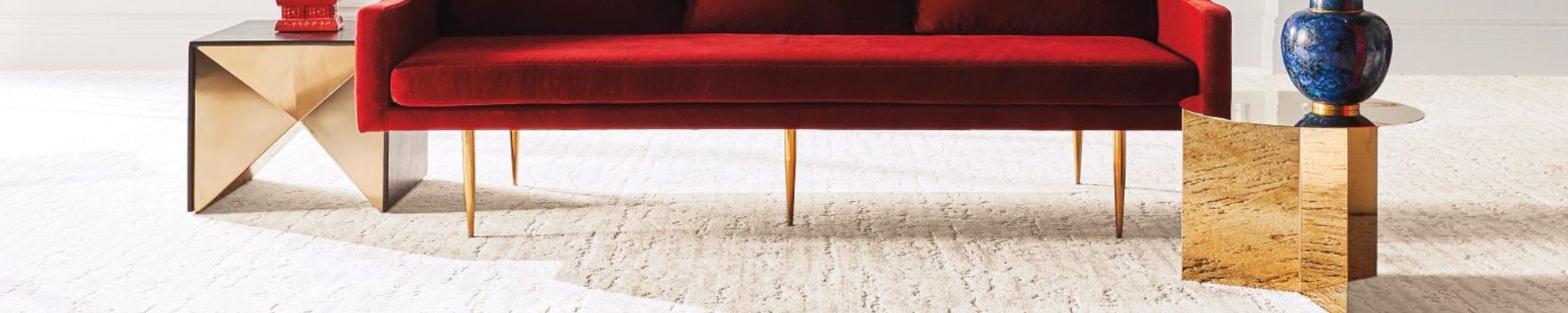 red couch on white carpet
